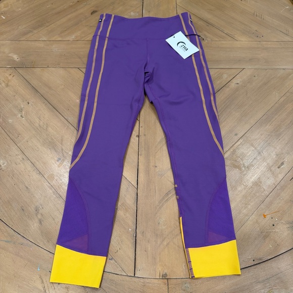 ZYIA Pants - ZYIA Active Purple Game Day Performance 7/8 Leggings Yellow Cuffs size 4 NWT
